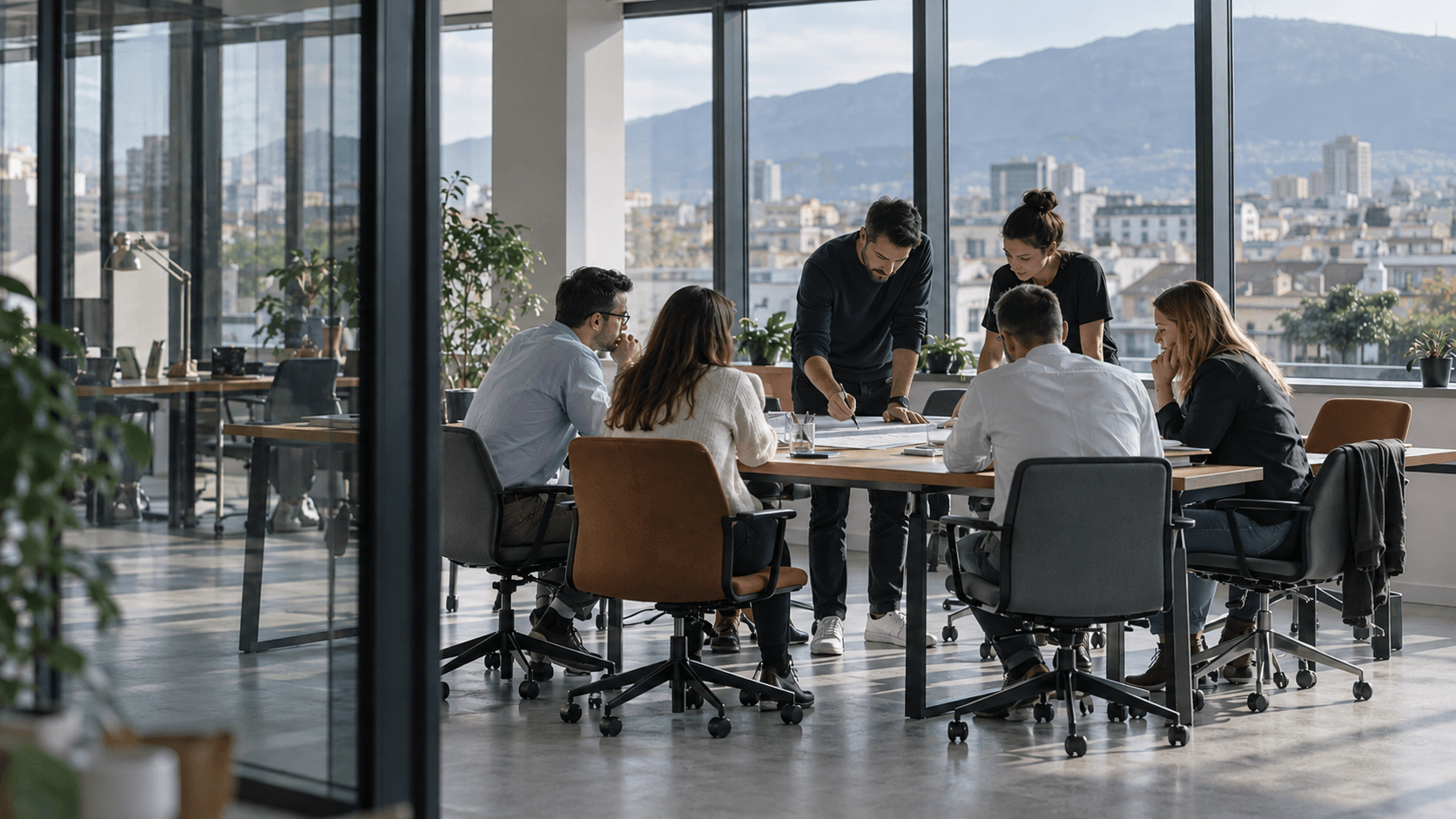 A delivery team in a working session around a long table